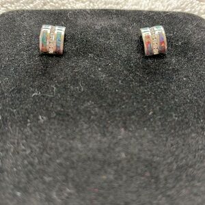 Silver with lab created opals and clear stones.